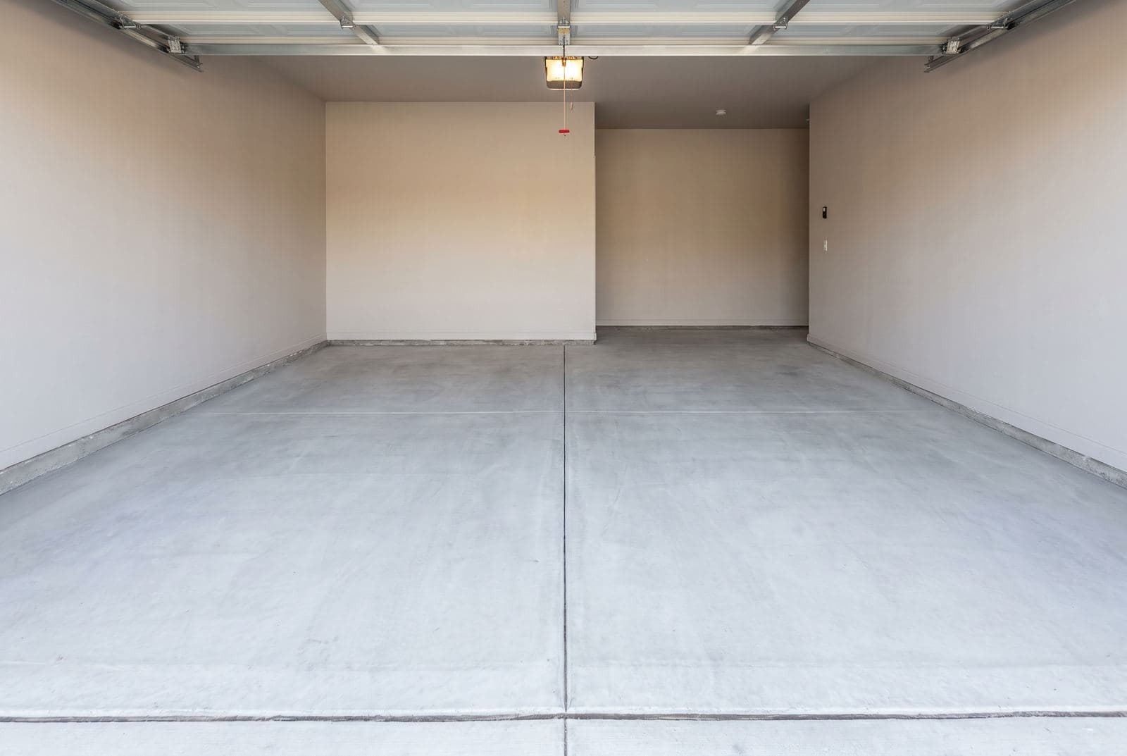 Smooth concrete floor in an empty two-car garage